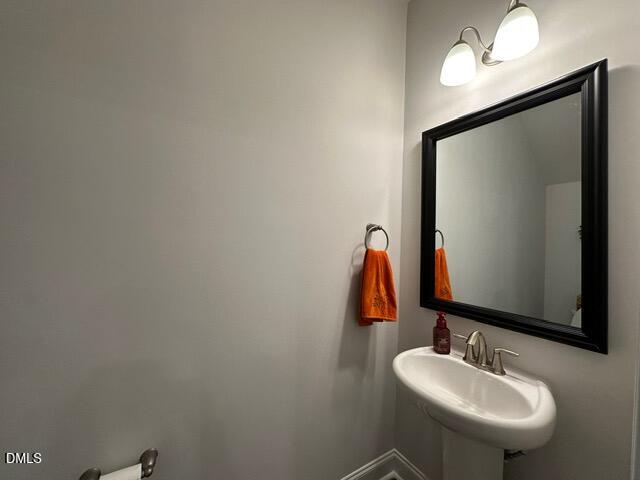 517 Flat Ford Road Hillsborough, NC 27278 - Photo 13 of 27 a bathroom with a sink and a mirror