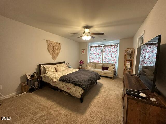 517 Flat Ford Road Hillsborough, NC 27278 - Photo 15 of 27 a bedroom with a bed and furniture with a flat tv screen