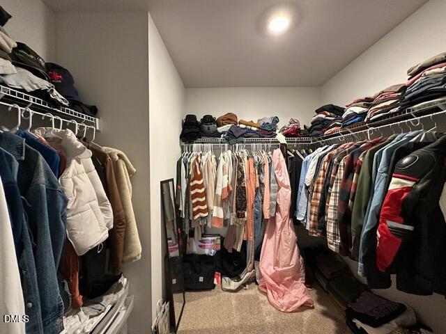 517 Flat Ford Road Hillsborough, NC 27278 - Photo 18 of 27 a view of walk in closet with clothes and shoes