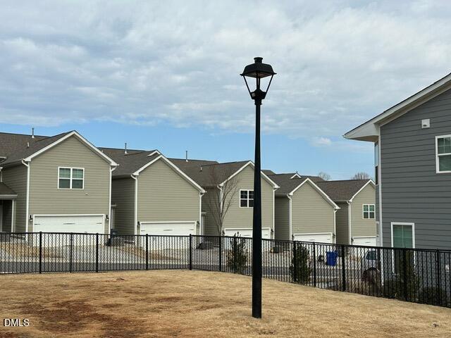 517 Flat Ford Road Hillsborough, NC 27278 - Photo 27 of 27 a front view of a house with a wooden fence
