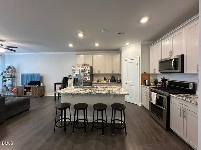 517 Flat Ford Road Hillsborough, NC 27278 - Photo 5 of 27 a kitchen with kitchen island granite countertop a dining table chairs stainless steel appliances and cabinets