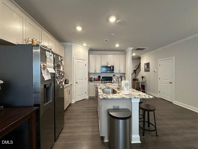 517 Flat Ford Road Hillsborough, NC 27278 - Photo 6 of 27 a kitchen with refrigerator and chairs