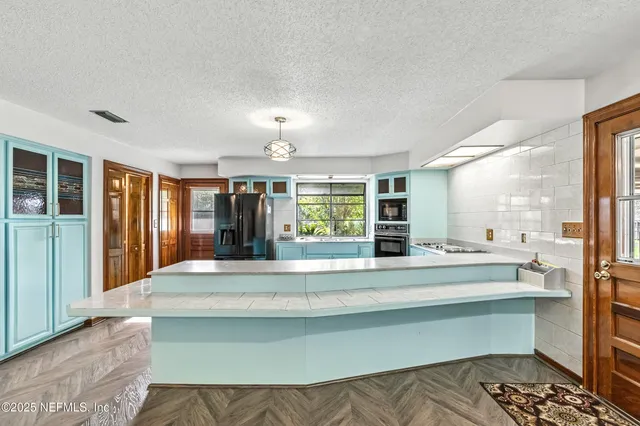 a bathroom with a sink and a large mirror