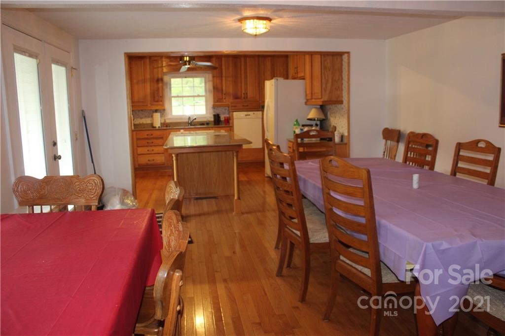 718 Bald Mountain Road Burnsville, NC 28714 - Photo 3 of 20 a workspace with furniture and window