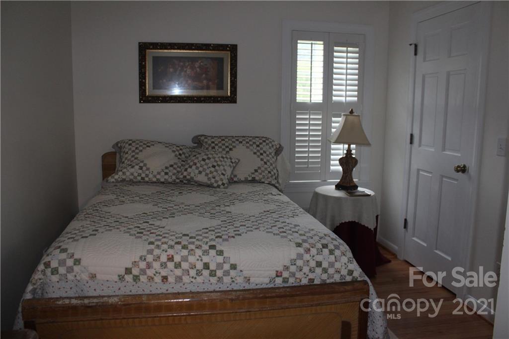 718 Bald Mountain Road Burnsville, NC 28714 - Photo 9 of 20 a bedroom with a bed and a window