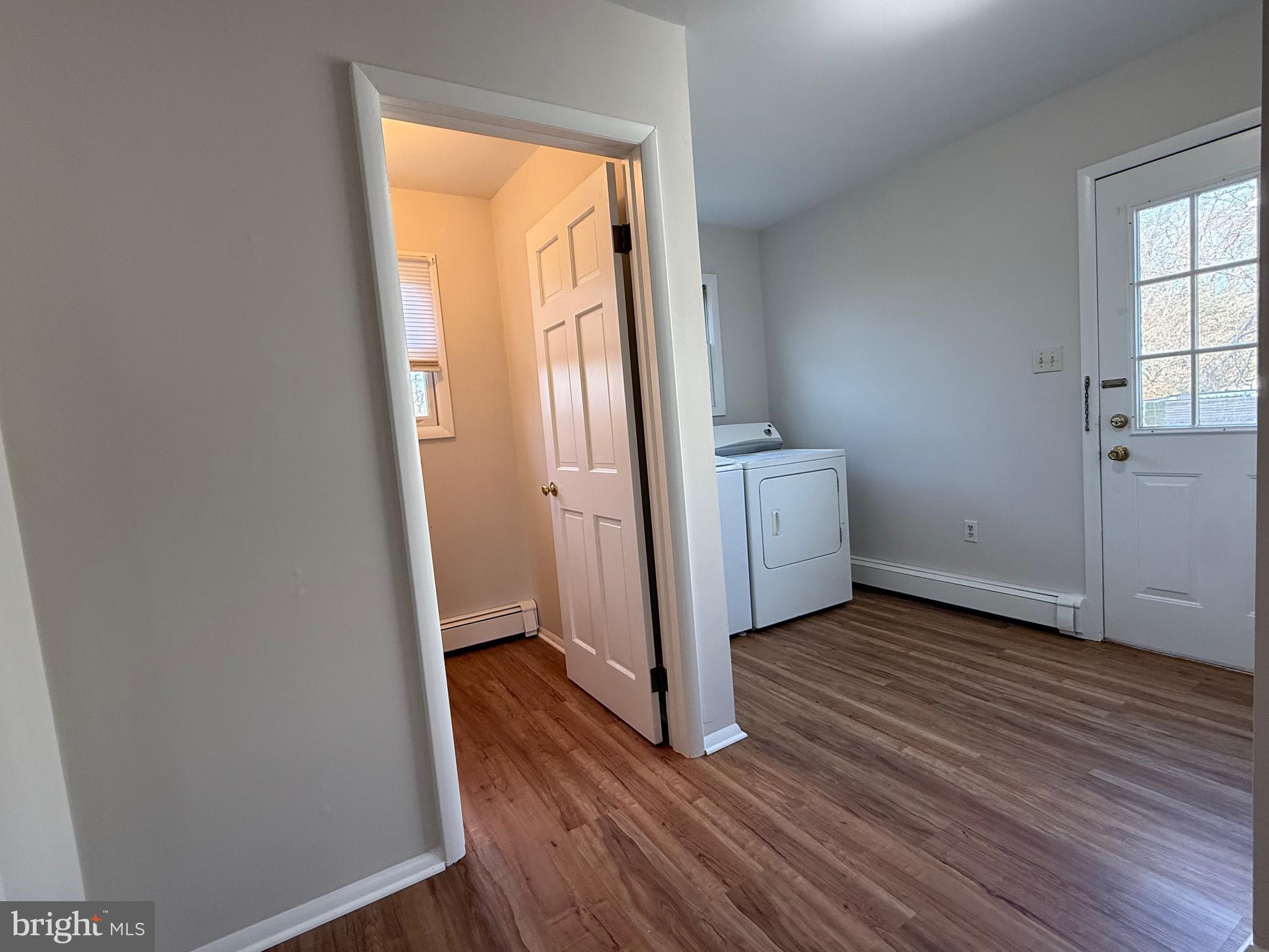 121 East Harmony Road West Grove, PA 19390 - Photo 15 of 50 an empty room with wooden floor and mirror