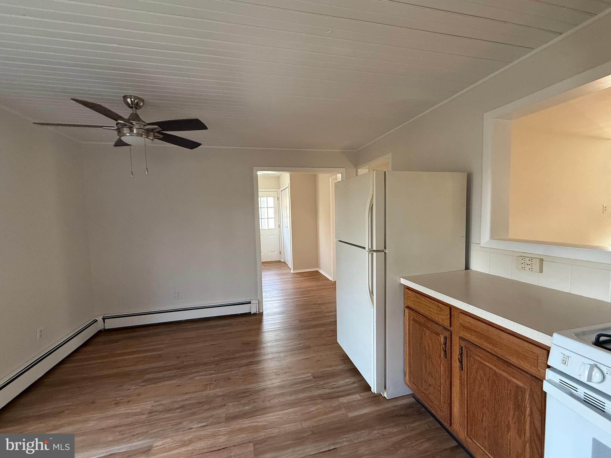 121 East Harmony Road West Grove, PA 19390 - Photo 16 of 50 a view of a kitchen with a sink ceiling fan and wooden floor
