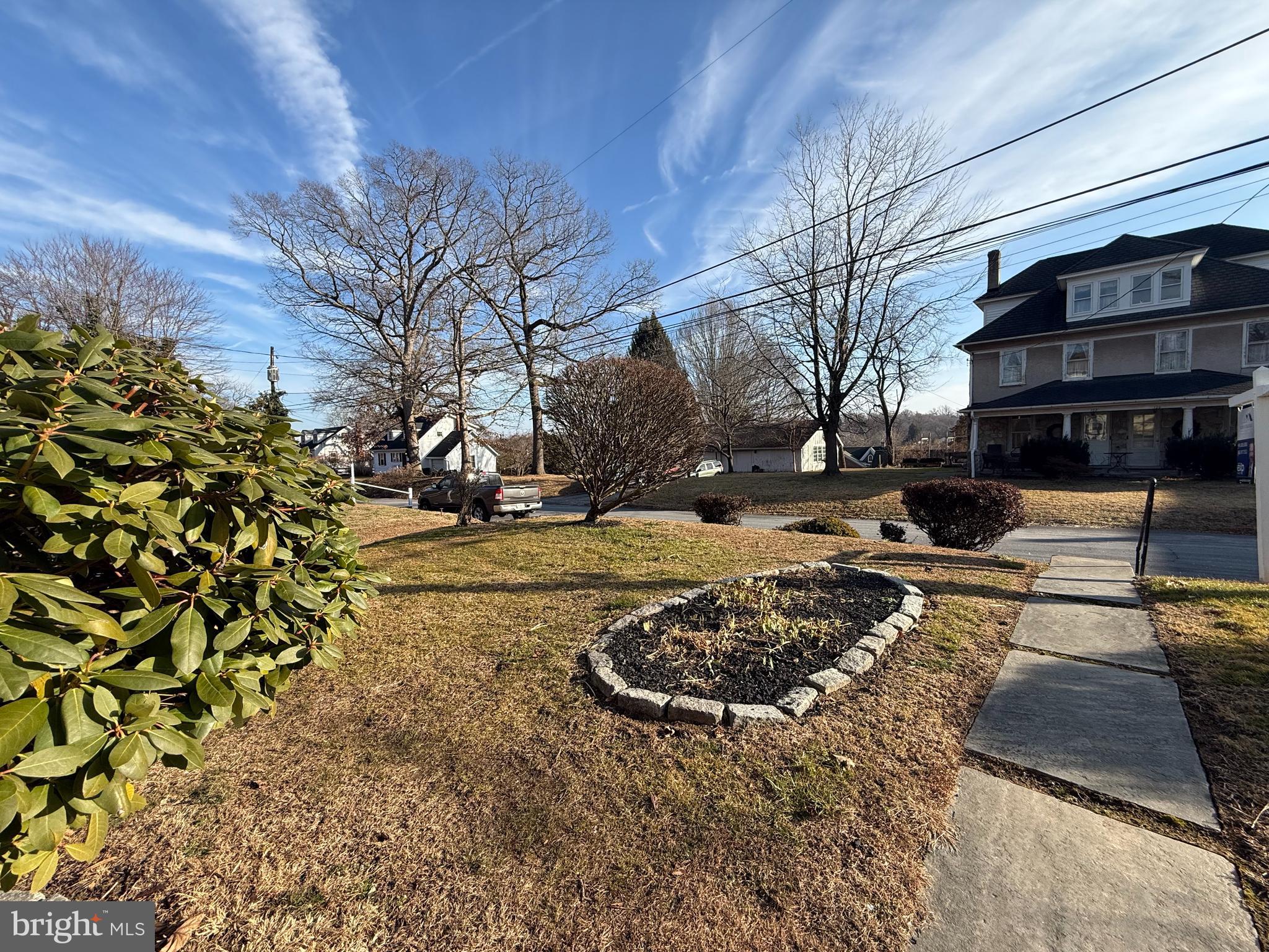 121 East Harmony Road West Grove, PA 19390 - Photo 4 of 50 a view of a yard with cars on road