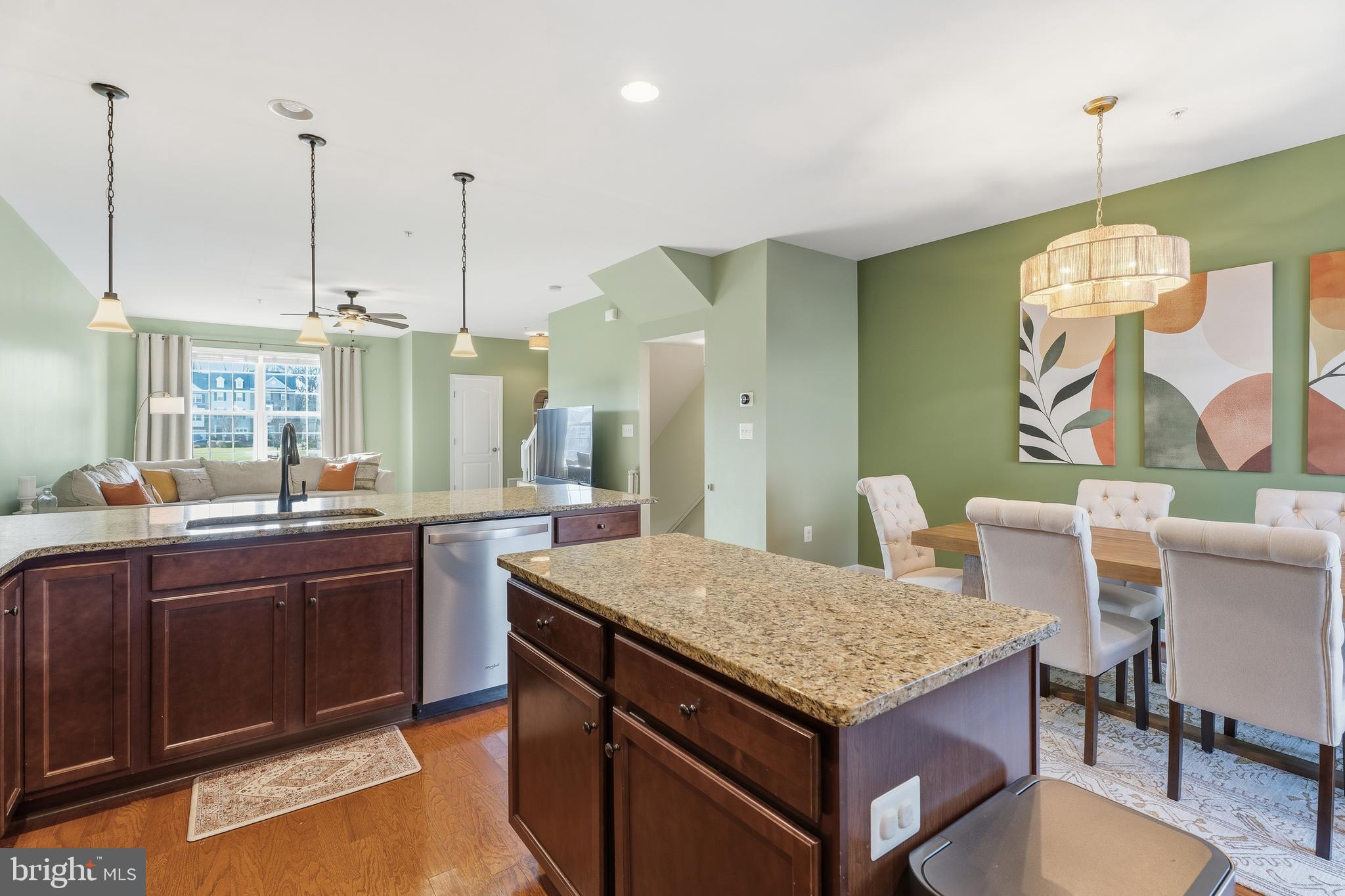 980 Winter Run Road Middle River, MD 21220 - Photo 13 of 43 a kitchen with a stove center island dining table and chairs