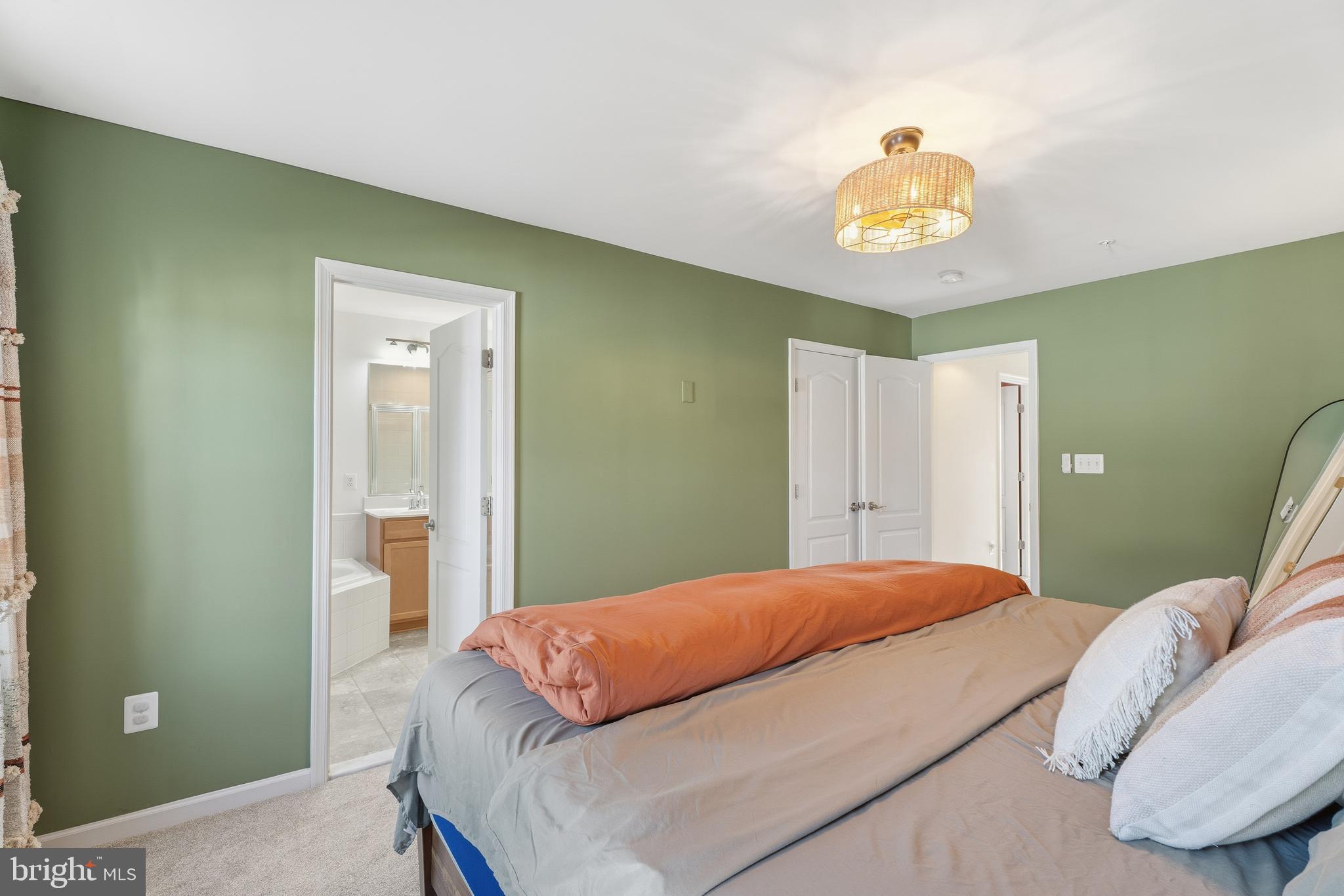 980 Winter Run Road Middle River, MD 21220 - Photo 27 of 43 a bedroom with a bed and a chandelier