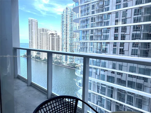 a view of a tall building from a balcony