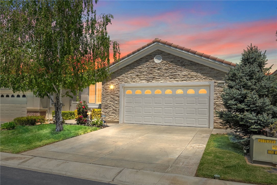 a front view of a house with a garage