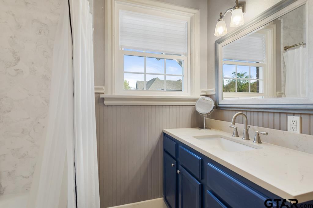 107 Rowland Place Tyler, TX 75701 - Photo 15 of 42 a bathroom with a sink and a mirror