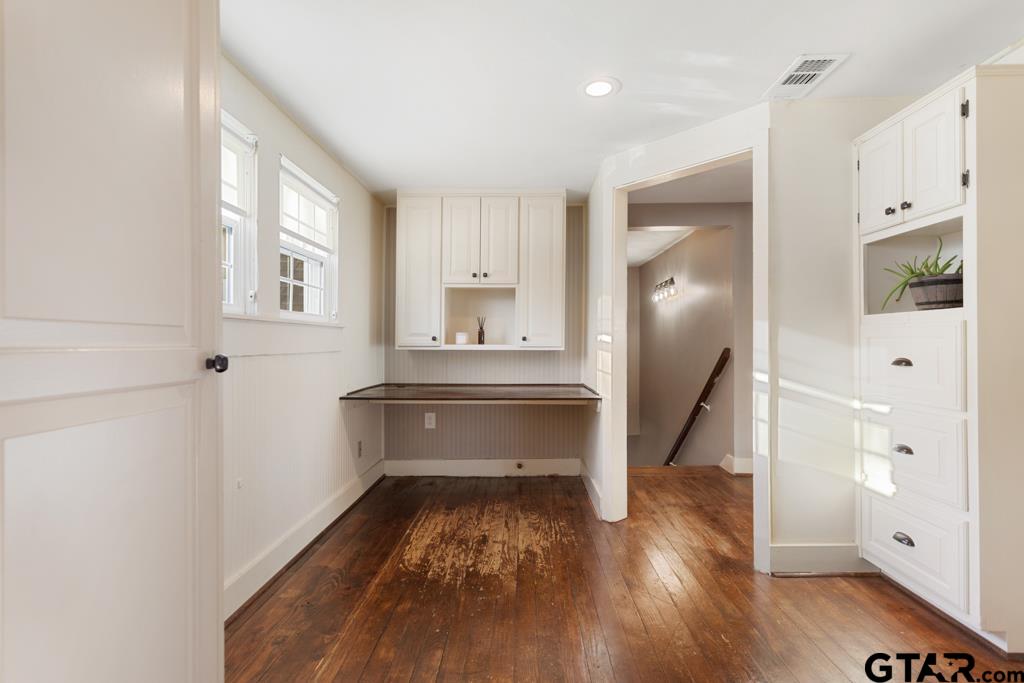 107 Rowland Place Tyler, TX 75701 - Photo 23 of 42 a view of room with window and wooden floor