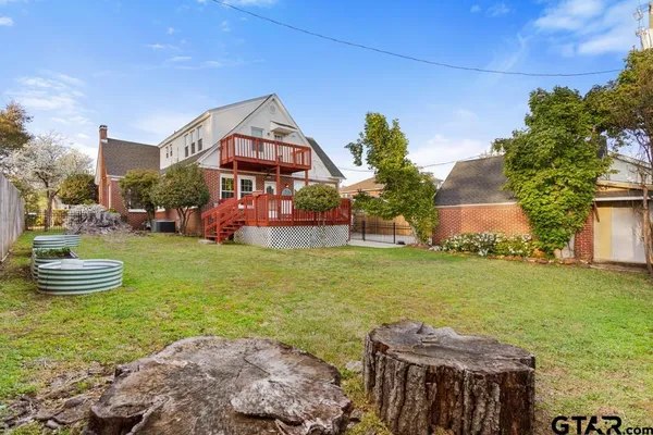 a front view of house with outdoor space and swimming pool