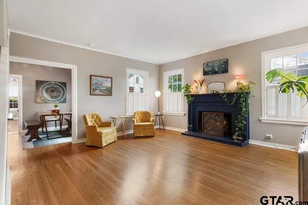 a living room with furniture and a fireplace