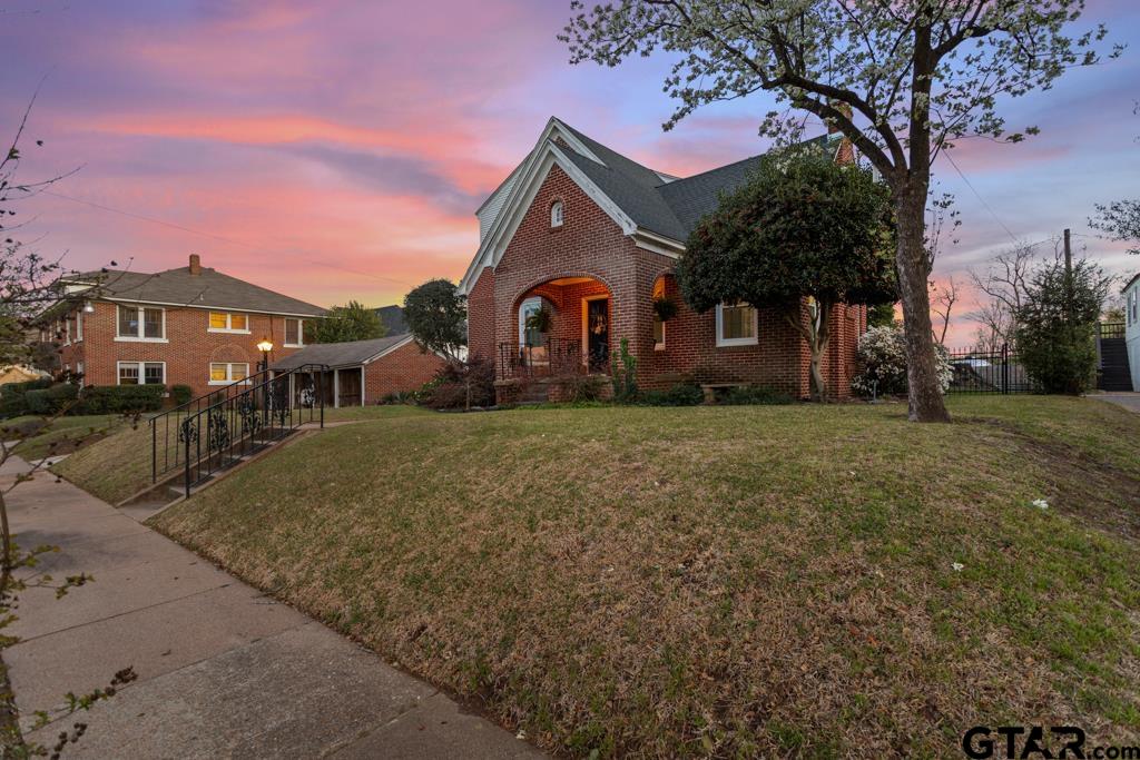 107 Rowland Place Tyler, TX 75701 - Photo 34 of 42 a front view of a house with a yard