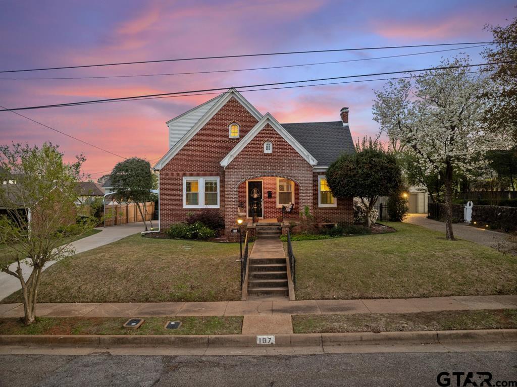 107 Rowland Place Tyler, TX 75701 - Photo 37 of 42 a front view of a house with a yard