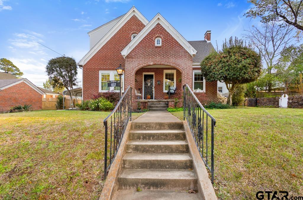 107 Rowland Place Tyler, TX 75701 - Photo 39 of 42 a front view of a house with a yard