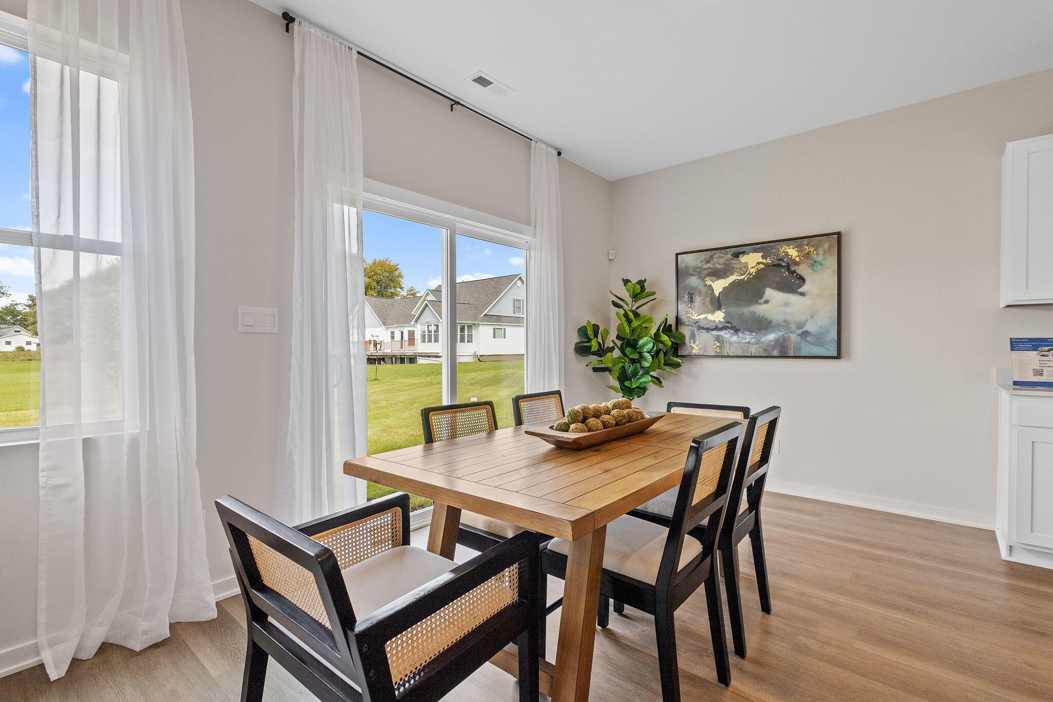 433 Fry Street Hebron, IN 46341 - Photo 7 of 24 a view of a dining room with furniture window and wooden floor