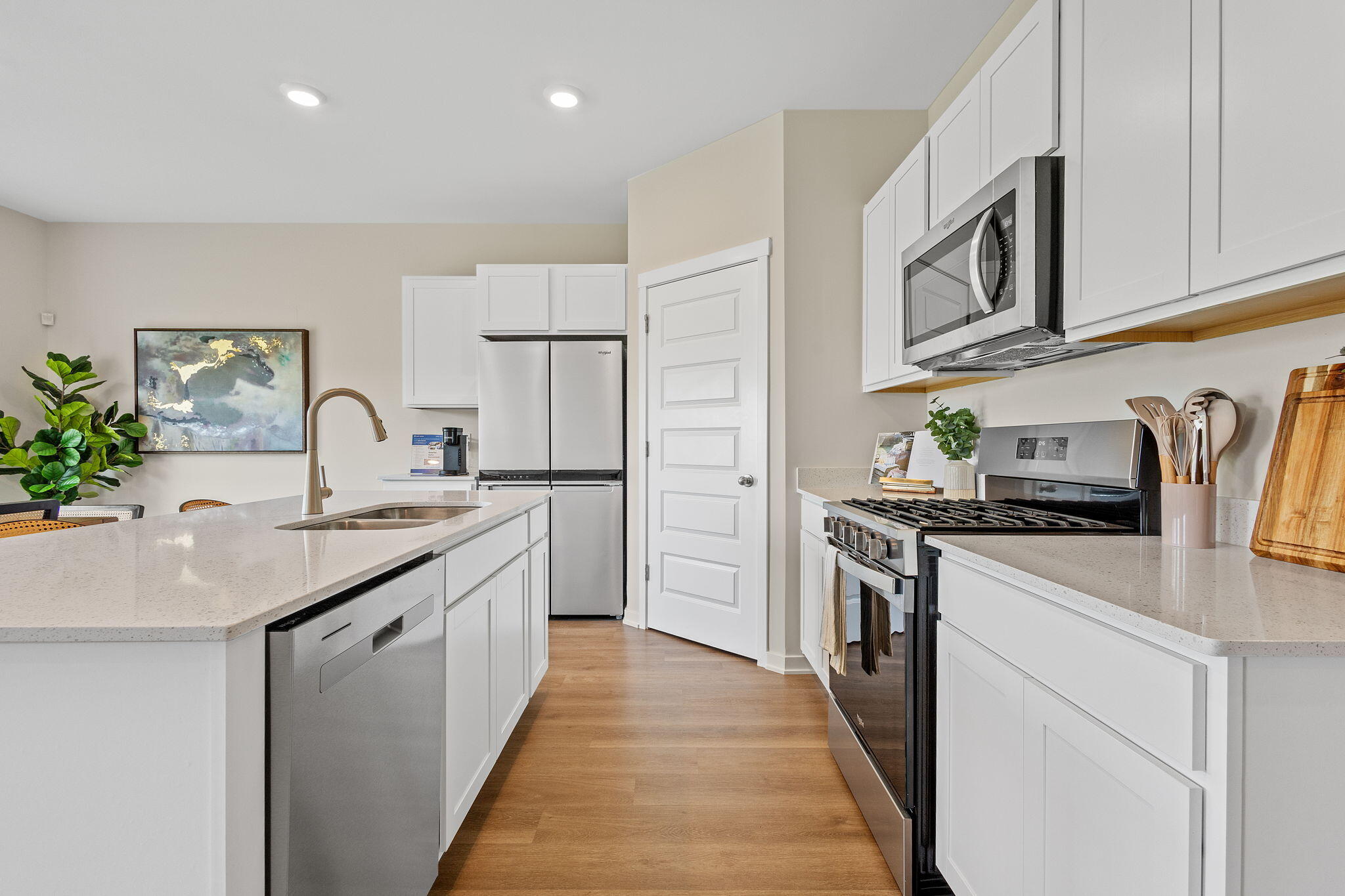 433 Fry Street Hebron, IN 46341 - Photo 8 of 24 a kitchen with stainless steel appliances granite countertop a sink stove and refrigerator