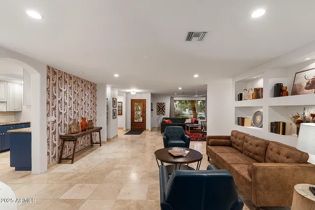 a living room with furniture and a couch