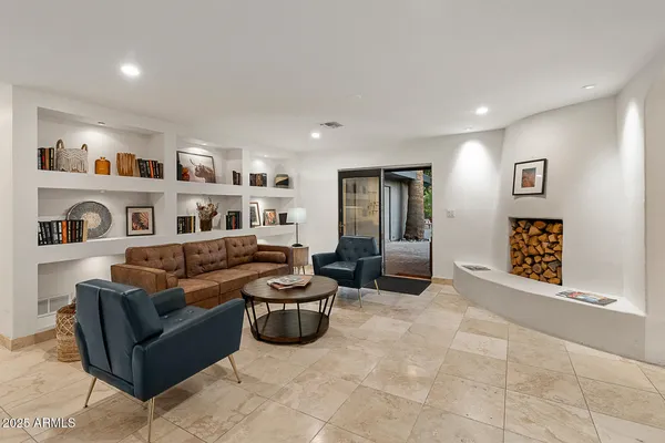 a view of a livingroom with furniture and entryway