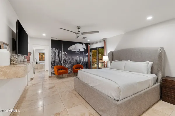 a bedroom with a bed and a couch