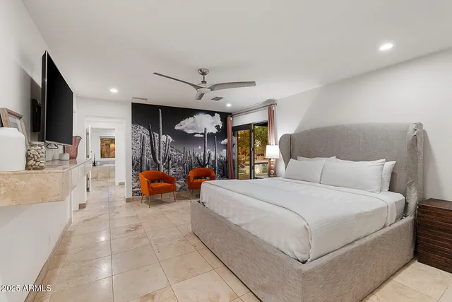 a bedroom with a bed and a couch