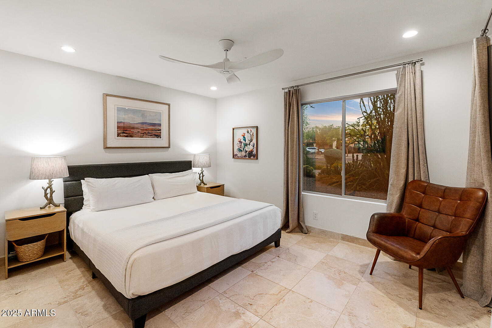 8433 East Cholla Street Scottsdale, AZ 85260 - Photo 19 of 29 a bedroom with a bed and a couch