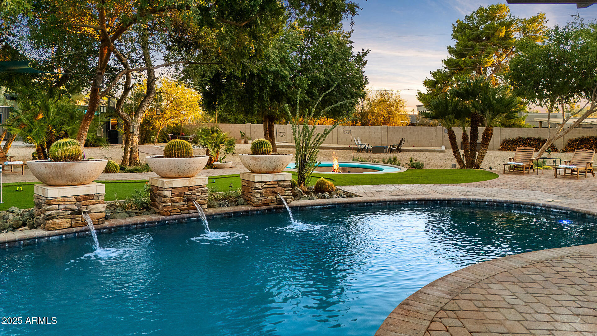 8433 East Cholla Street Scottsdale, AZ 85260 - Photo 2 of 29 a view of a swimming pool with a patio and a yard