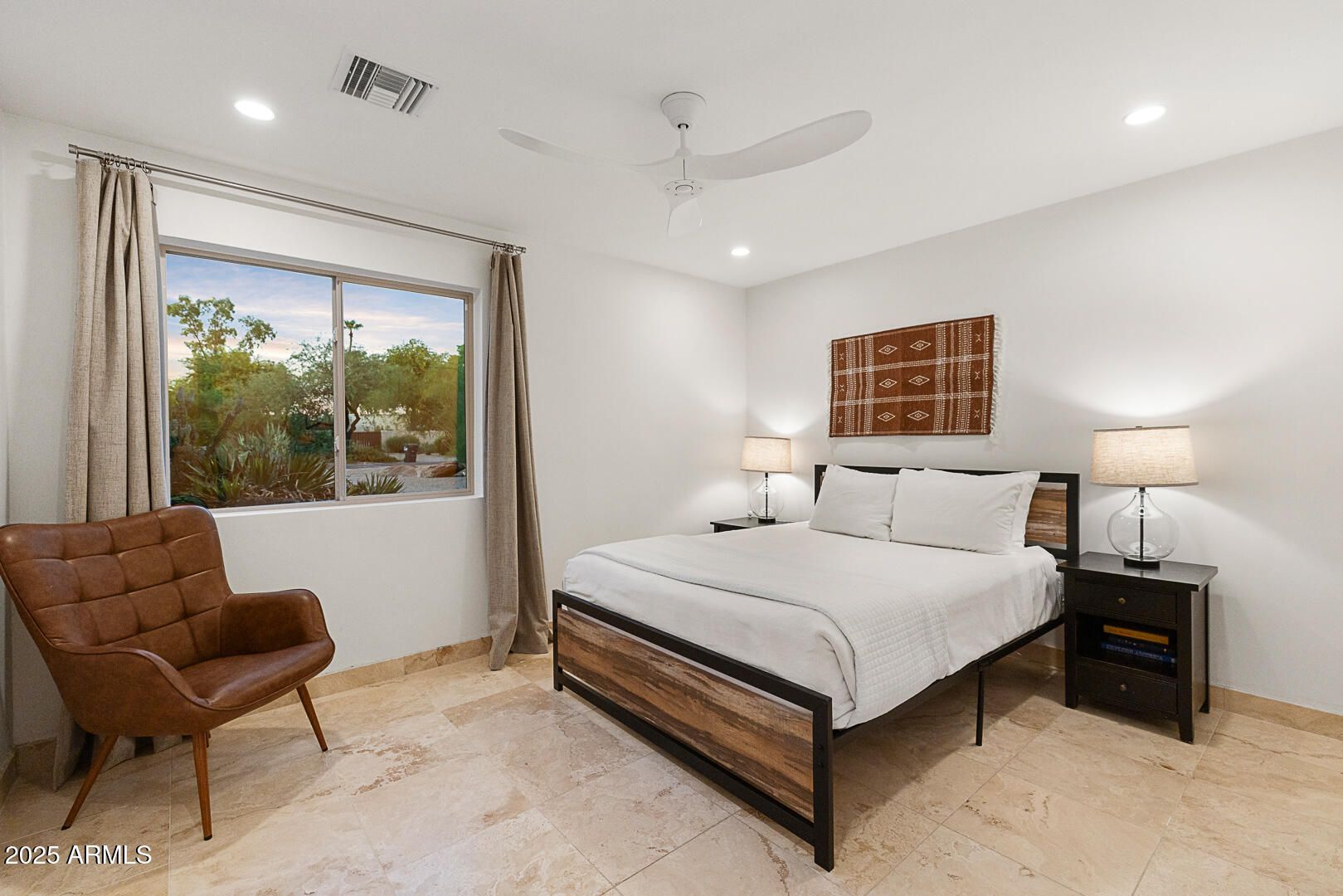 8433 East Cholla Street Scottsdale, AZ 85260 - Photo 21 of 29 a bedroom with a bed and a large window