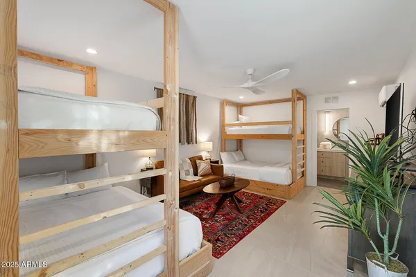 a bathroom with a toilet a sink and a mirror