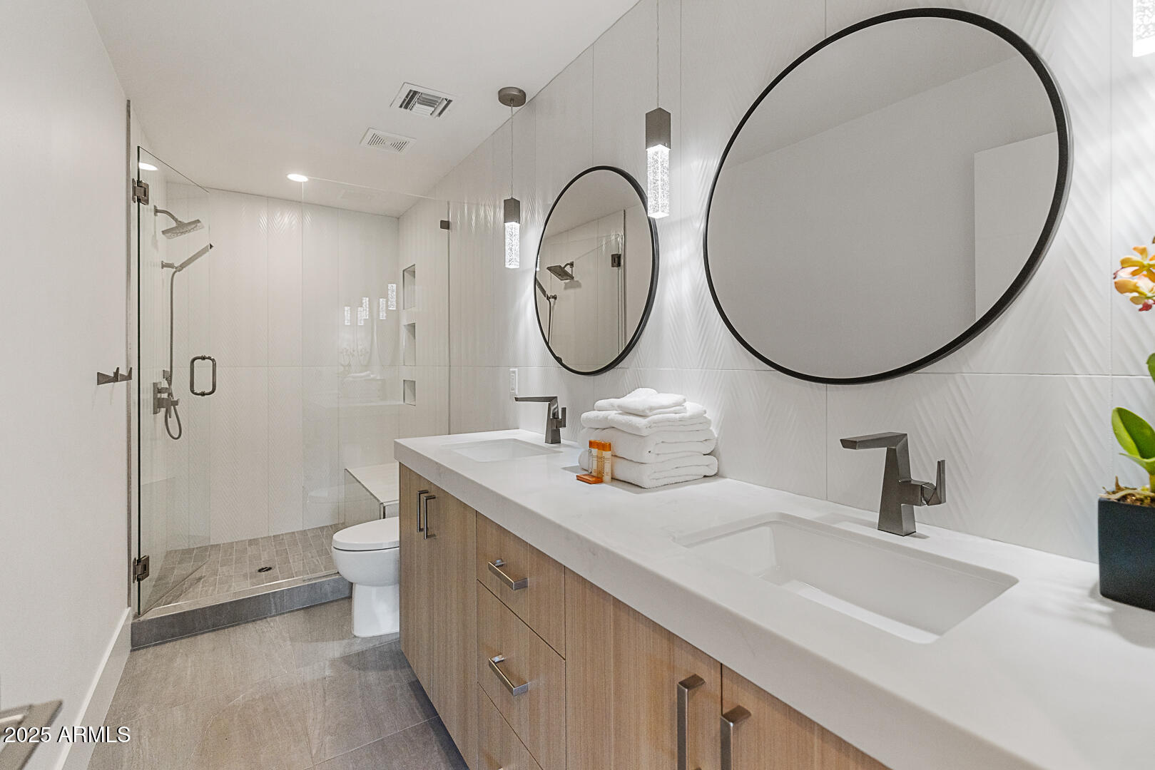 8433 East Cholla Street Scottsdale, AZ 85260 - Photo 23 of 29 a bathroom with a toilet a sink and a mirror