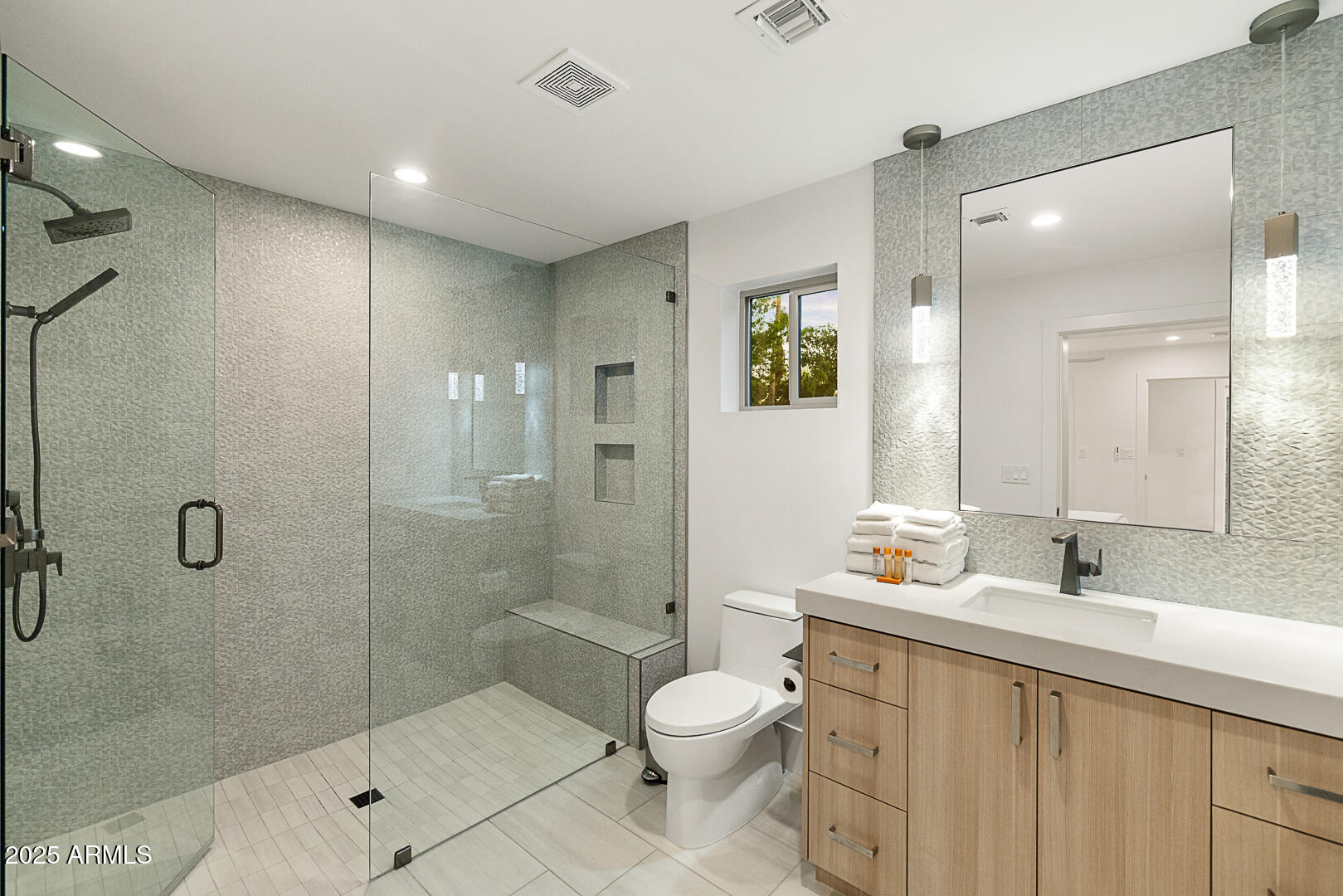 8433 East Cholla Street Scottsdale, AZ 85260 - Photo 25 of 29 a bathroom with a toilet a sink and shower