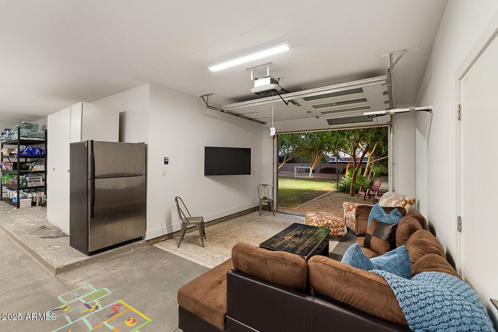 8433 East Cholla Street Scottsdale, AZ 85260 - Photo 27 of 29 a living room with furniture and a flat screen tv