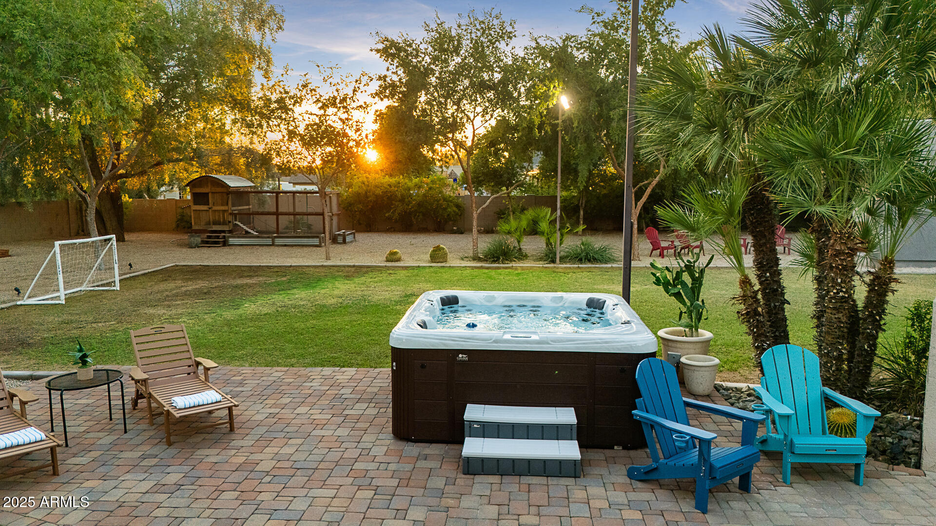 8433 East Cholla Street Scottsdale, AZ 85260 - Photo 3 of 29 a view of a swimming pool and lounge chairs in back yard
