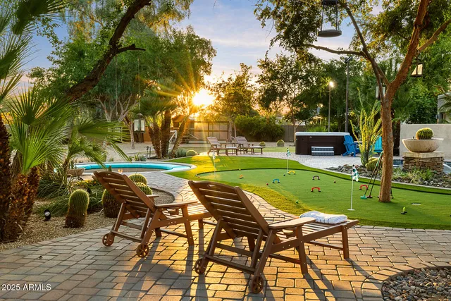 a view of a swimming pool with a lounge chairs