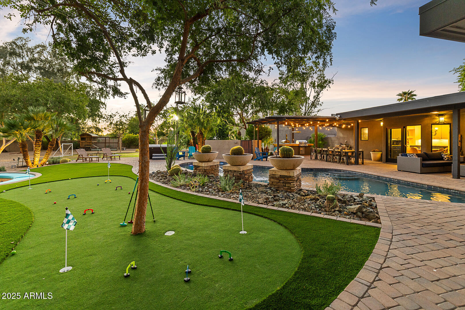 8433 East Cholla Street Scottsdale, AZ 85260 - Photo 5 of 29 a view of a swimming pool with a patio