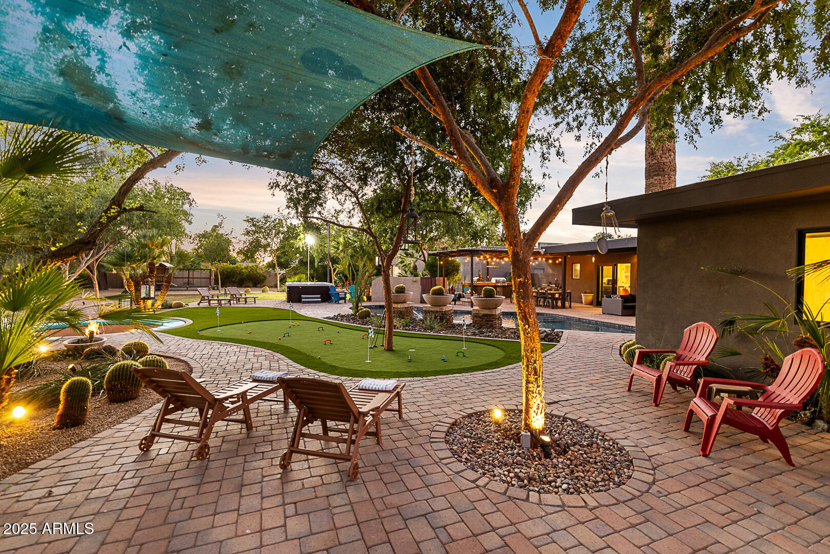8433 East Cholla Street Scottsdale, AZ 85260 - Photo 6 of 29 a view of a swimming pool with lawn chairs under an umbrella
