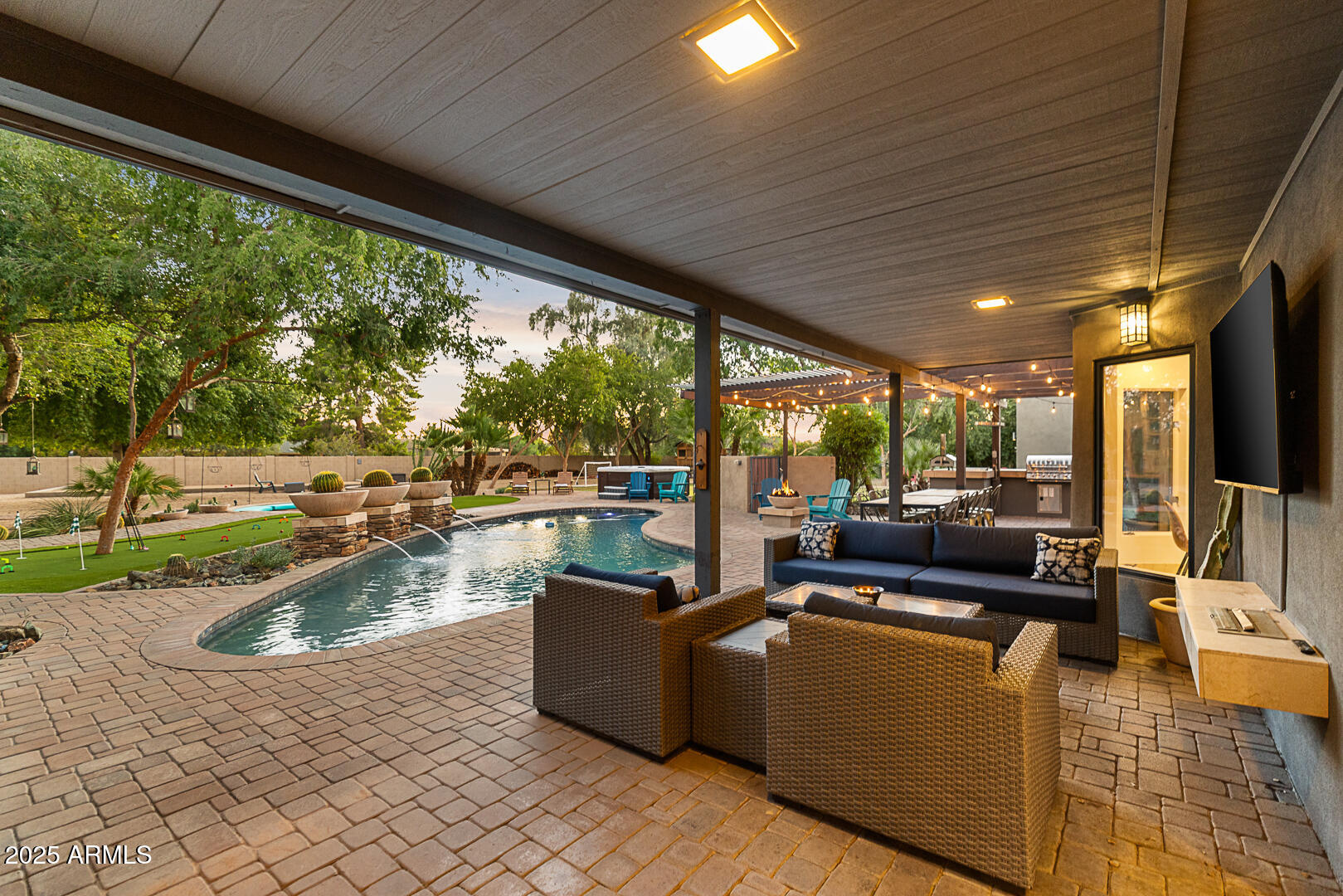 8433 East Cholla Street Scottsdale, AZ 85260 - Photo 8 of 29 a view of a swimming pool with a patio