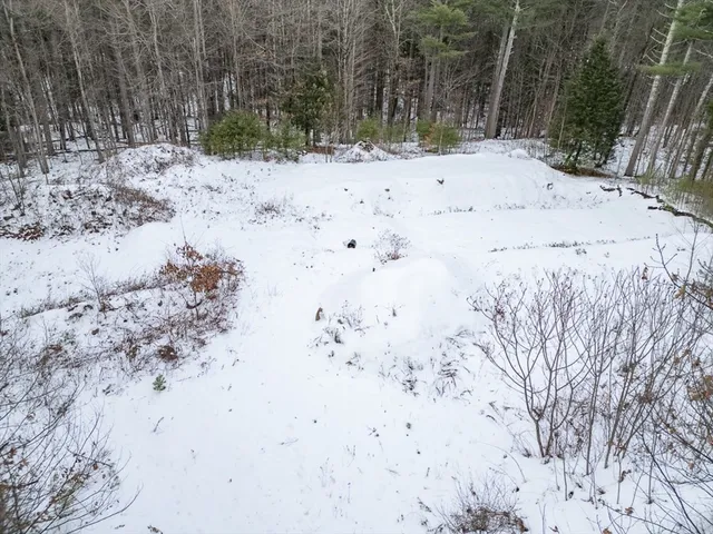 a view of snow covered with snow in front of house