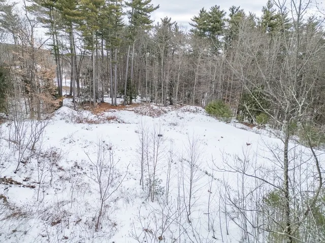 a view of snow on the road