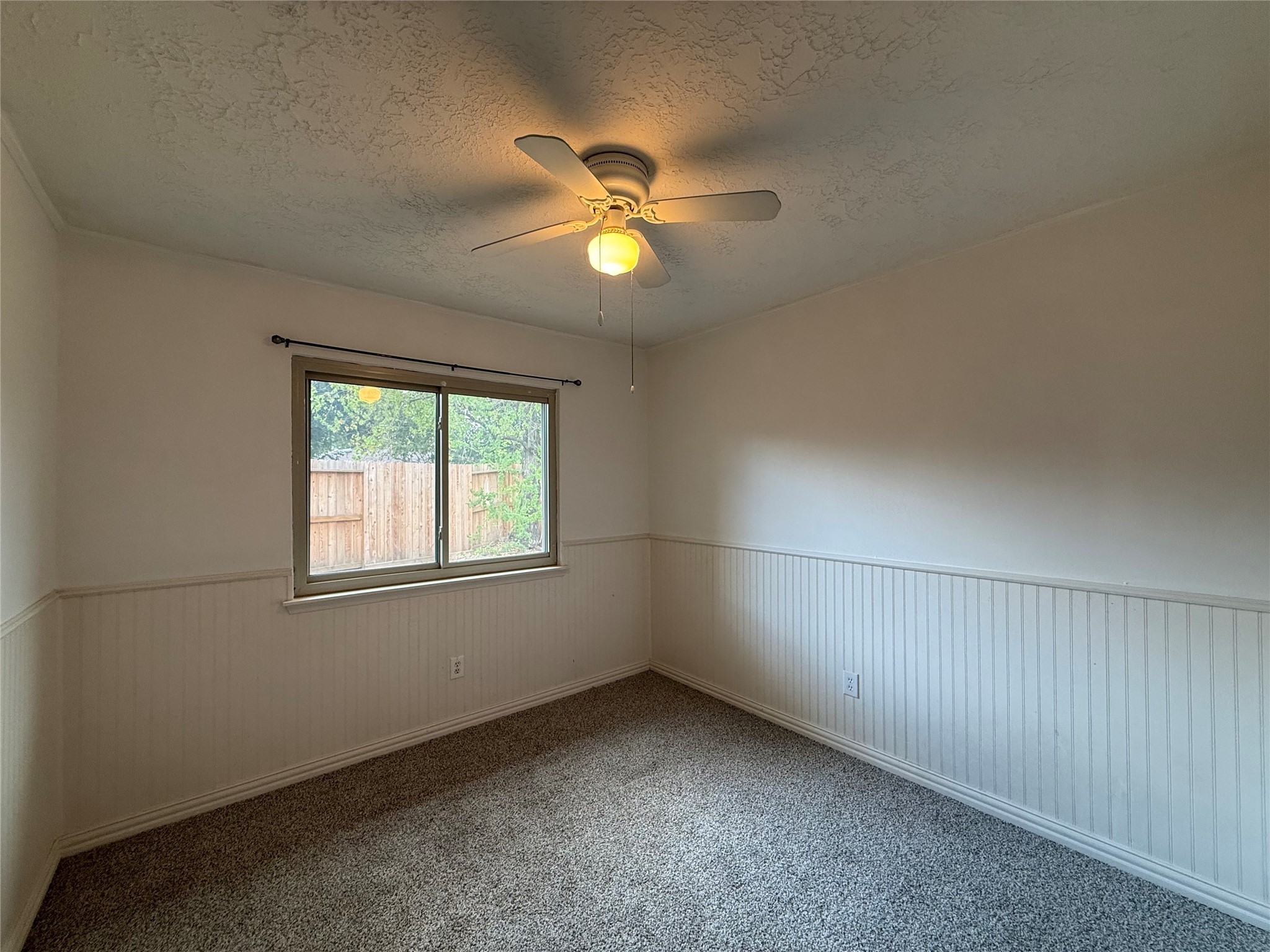 4722 Enchanted Rock Lane Spring, TX 77388 - Photo 13 of 22 an empty room with ceiling fan and window