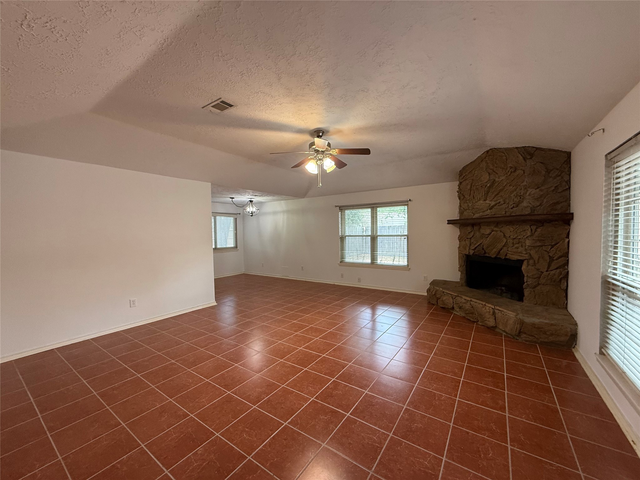 4722 Enchanted Rock Lane Spring, TX 77388 - Photo 2 of 22 a view of an empty room with a fireplace and a window