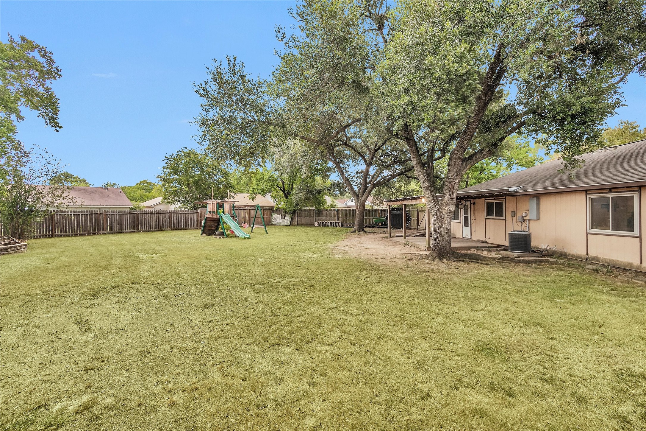 4722 Enchanted Rock Lane Spring, TX 77388 - Photo 22 of 22 a view of a house with backyard and trees