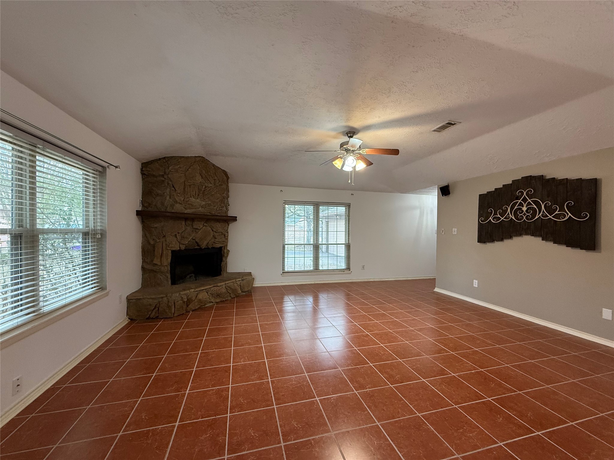 4722 Enchanted Rock Lane Spring, TX 77388 - Photo 4 of 22 a view of an empty room with window and chandelier fan