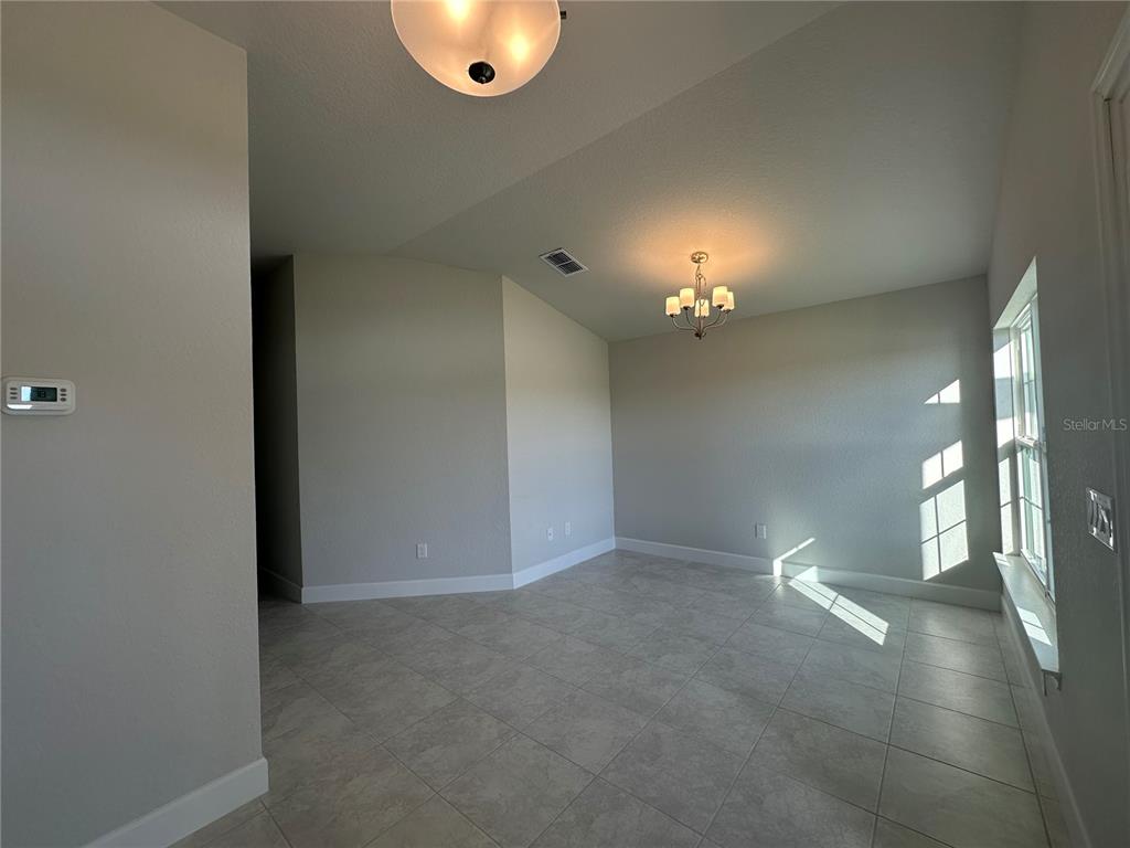 4413 Southwest 90th Place Ocala, FL 34476 - Photo 3 of 17 a view of a livingroom and a chandelier fan