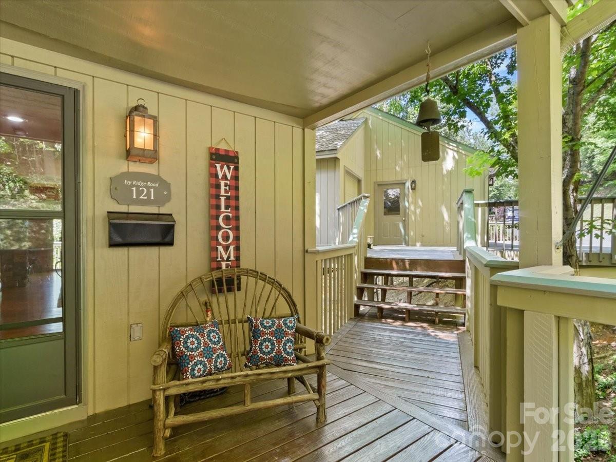 121 Ivy Ridge Road Burnsville, NC 28714 - Photo 43 of 48 a view of a chairs and table on the balcony