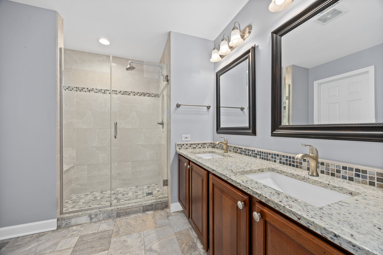 725 Delacourte Avenue Bolingbrook, IL 60490 - Photo 21 of 38 a bathroom with a granite countertop sink mirror and shower